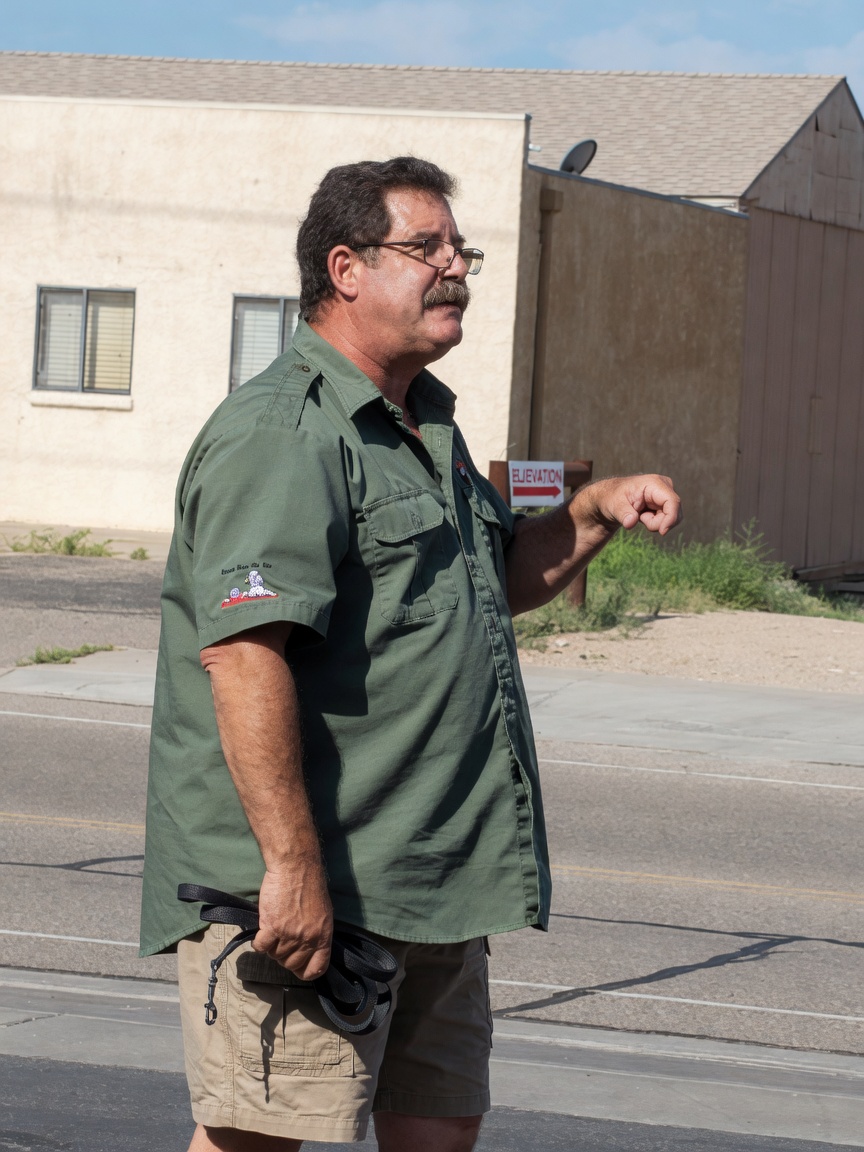 Roy standing on a bank outdoors
